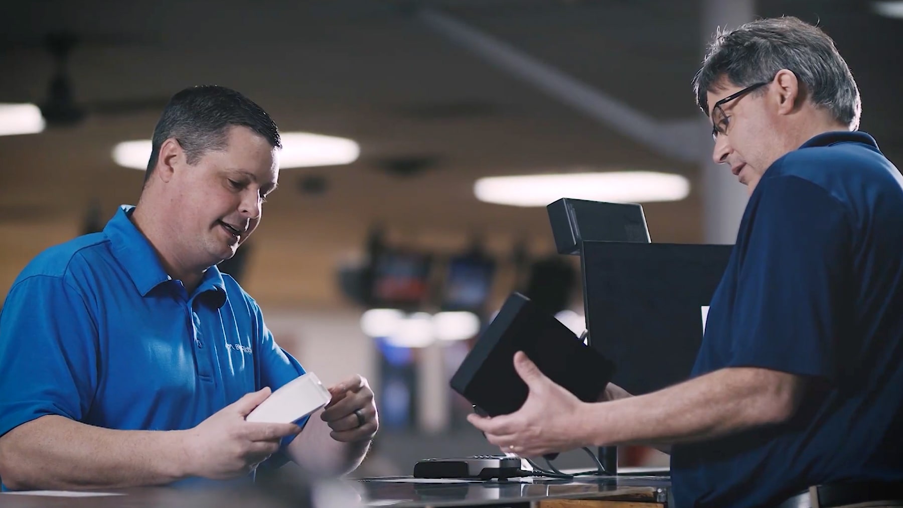 Video thumbnail showing Eric working with a Blue Ridge employee to install internet