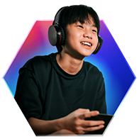 Young gamer wearing headphones playing online games, representing fast 700 Mbps internet for multiple users and devices.