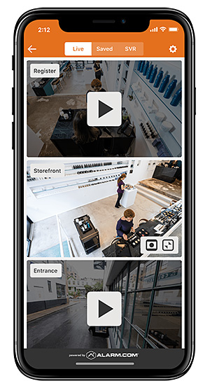 Smartphone showing multiple HD security camera feeds for a register, storefront, and entrance