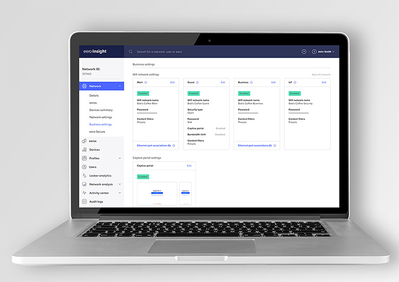 Laptop displaying the eero Insight account portal with network settings, captive portal options, and management tools for business WiFi.